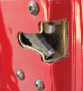 Repairing a sticking door latch with a dry lubricant increases customer satisfaction. It’s all part of a premium inspection and maintenance service.