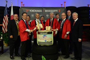 At the opening of Yokohama Tire Manufacturing Mississippi (YTMM) in West Point, Mississippi on Oct. 5, a traditional Kagami Biraki ceremony was held. Participants were (front to back): Mr. Tadaharu Yamamoto, president of YTMM; Mr. Robbie Robinson, Mayor of West Point; Mr. Glenn McCullough, executive director of the Mississippi Development Authority (MDA); Mr. Joe Max Higgins, CEO of the Golden Triangle Development Link; Mr. Phil Bryant, governor of Mississippi; Mr. Hikomitsu Noji, president and representative director of The Yokohama Rubber Co., Ltd.; Mr. Trent Kelly, U.S. congressman; Mr. Takaharu Fushimi, CEO of Yokohama Corporation of North America & Yokohama Tire Corporation; Mr. Tate Reeves, Mississippi Lieutenant Governor; and Mr. Masami Kinefuchi, consul-general of Japan in Nashville.