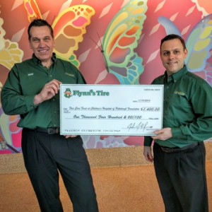 Mark Zvolensky (left) and Joe Durkoske (right) were the presenters of a check from Flynn's Tire Group to Children's Hospital of Pittsburgh Foundation.