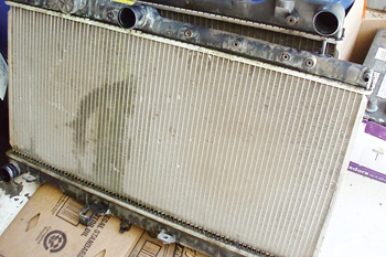 While they might appear in good condition, this stack of scrap radiators emphasizes the importance of inspecting for hidden leaks around the header tank seals.