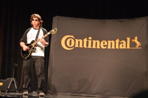 Barry Terzaken, product manager of light truck tires for Continental Tire the Americas, grabs a wig and guitar to rock out during the 2016 Gold Dealer Meeting.