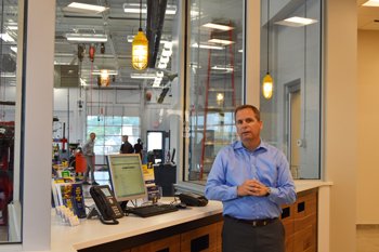 Fred Thomas, vice president and general manager of Goodyear Retail, stands in the newly renovated Goodyear Auto Service location at Summit Mall.