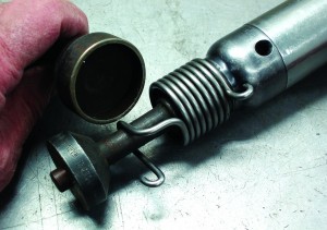 Photo 5: This impact hammer is equipped with a bushing removal bit and a bushing installation bit.
