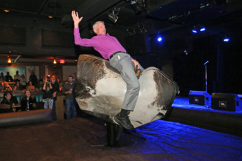 K&M Tire founder Ken Langhals rides the bull – and later nails his landing – at Wild Bill’s Saloon in Banff, Alberta. 