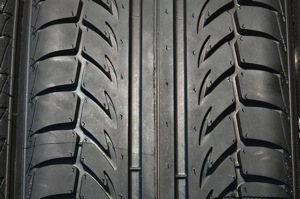 The tire's tread includes a hooked design that provides biting edges for grip at any cornering angle, among other attributes.