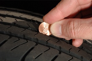 Tire Rack officials suggest the traditional penny test needs to be replaced with a quarter test, since a tire's performance is substantially different with 2/32nds vs. 4/32nds of remaining tread.