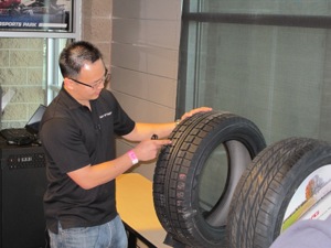 William Hong, Nitto marketing analyst and project coordinator, reviews the tires tread features, which include advanced 3D interlocking, multi-wave siping; and a combination of circumferential grooves and wide lateral grooves to evacuate slush for increased grip.