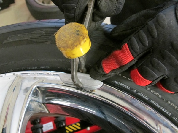 2: remove any wheel weights, again being careful not to damage wheel.