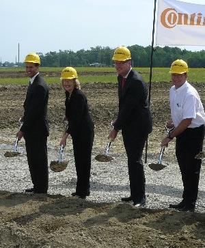 Dan Seals, assistant director of the Department of Commerce and Economic Opportunity, Mt. Vernon Mayor Mary Jane Chesley, CTA CEO Matthias Schoenberg, and CTA vice president of manufacturing Benny Harmse dig in to get the expansion project started.