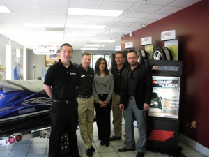 On hand for the presentation of a personal watercraft to Griffin Brothers Tire in Cornelius, N.C., were (from left): Jay Wright of Michelin North America, Russ Carter of Griffin Brothers, Estrella Soto of American Tire Distributors, Larry Griffin Jr. of Griffin Brothers, and Jeremy Lewin of ACCC. 