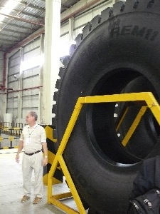 Art LeBlanc of Pete's Tire Barns sizes up one of Double Coin's test production 57-inch giant OTRradials.