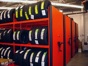 Even with limited floor space, dealers can still max out their storage options with mobile racks like these.