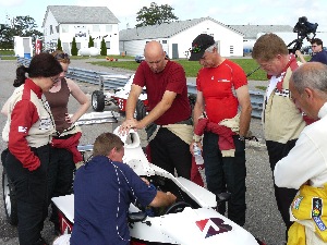 Chief instructor Jamie Fitzmaurice shows the cockpit controls to participants.