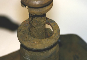 This rear strut shows the ultimate result of neglect and/or lack of inspection. The seal and upper part of the tube are completely gone. The housing has been distorted by braking forces. The driver thought they had brake problems and did not notice the changes in vehicle behavior over the period of time it took the strut to degrade.  