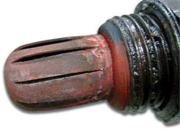 this badly contaminated oxygen sensor produces a biased signal that causes a rich condition after the engine enters closed-loop operation.