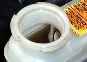 the master cylinder should be free of sludge and the brake fluid should appear to be clear tan or brown.