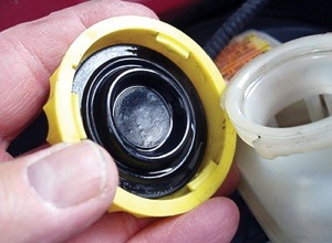 the rubber seal on the master cylinder cap should be in the retracted position and seat into the caps inner diameter.