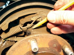 since leaking brake fluid or axle lubricant will ruin new brake shoes, checking for wheel cylinder and axle shaft seal leakage should be a routine part of any brake inspection.