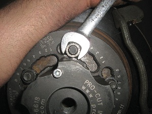 when mounting an on-the-car lathe's hub adapter, be sure to avoid using an impact wrench, as it can cause over torquing and damage the adapter.
