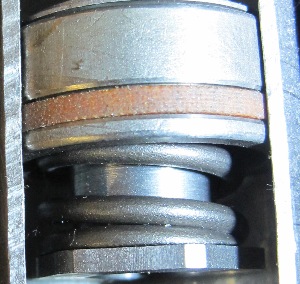 one area of wear is the seal between the piston and bore. the seal must prevent fluid from flowing between the two surfaces without creating excessive amounts of friction. if the seal allows too much fluid to pass, it will influence how the valves in the piston and base perform. if the fluid becomes contaminated, it can cause wear to the bore and piston. according to some shock and strut suppliers, wear on these surfaces does not happen until the unit has become significantly degraded.