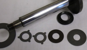 Here is where most of the wear occurs in a shock or strut. These small discs of metal are mounted on the shaft and are held in place with either a nut or a nut and spring. As the piston moves, the discs deflect and fluid moves between the two chambers. Even under normal conditions on a smooth road, shocks stroke on average 1,750 times for every mile traveled. The action causes a shearing action on the fluid that is not unlike what motor oil is subjected to when it is between engine bearings. This action can break down the base oil and additive package. The wear on the fluid can change the viscosity of the fluid and make the unit unable to dampen suspension movement. The discs and springs in the valves can also suffer from metal fatigue due to the constant movement of the suspension and the passing of the fluid.