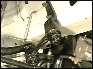The idler arm is attached to the chassis and is positioned parallel to the pitman arm.