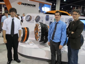 from left: ben zavala and mark hearn, first and second place winners of hankooks tire design for the future environment competition, with university of cincinnati professor raphael zammit.