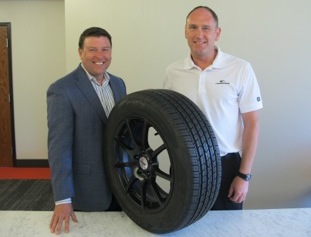 Scott Jamieson, director of product management (left), and Bruce Sanborn, product segment manager, show off the features of Coopers new CS3 Touring tire.