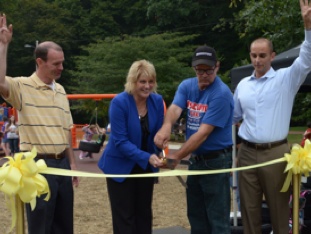 Ribbon cutting in Massillion, Ohio. From left to right: Doug Nist, Massillon Parks and Rec, Kathy Carassaro-Perry, Mayor of Massillon, Russ Boughman, Owner  of Discount Tire Outlet Tire Pros, Ron Sinclair,  SVP Marketing , ATD 