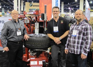 Hennessy's Kevin Keefe, vice president of marketing, with representatives from Schlenker Automotive, manager Donald Smith and tech Bruce Christian. Bruce was featured in the short film. 