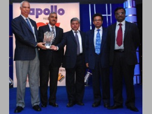 Posing with two awards winners are (L to R) P.M. Telang, managing director of India operations for Tata Motors; Satish Sharma, chief of India operations for Apollo Tyres; and R. Pisharody, president of Tatas Commercial Vehicles Business Unit.