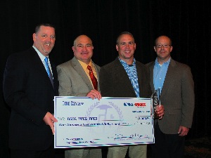 Dan and Dale Nothdurft, owners of Tires, Tires, Tires, were on hand during Mondays Tire Industry Honors event to accept Tire Reviews Top Shop Award. Pictured here (from left to right) are: Babcox Media and Tire Review Regional Sales Manager Dean Martin, Dan Nothdurft, Dale Nothdurtf, and Kevin Keefe, vice president of marketing for Hennessy Industries.