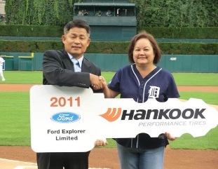 Hankook Tire America Corp. President Soo II Lee presented Teresa Holder with the key to her new Ford Explorer Limited as part of the Great Catch 2011 giveaway.