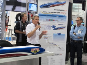 Danny Thompson explains the design of the Challenger 2.5 at the Mickey Thompson booth during the SEMA Show.