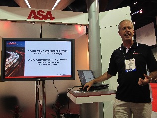 ASA Automotive Systems president Ken Halle shows the company's mobile technology.