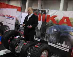 Patrick Hyland, Vee Rubber sales and marketing manager, shows the features of the tiremakers four new rollouts.
