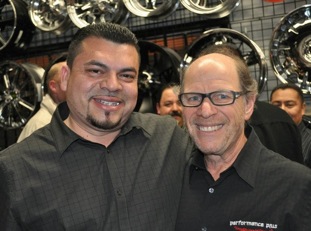 Performance Plus Tire & Auto owners Hank Feldman (right) and Ricky Oropeza at the company's 40th anniversary celebration.