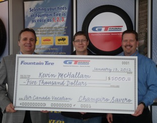 Giti Tire Canada Sales Director Lou Monico (left) and Fountain Tire Chilliwack store manager Wally Smith (right) present a $5,000 check to Chilliwack resident Kevin McHallam, grand prize winner of the GT Radial 